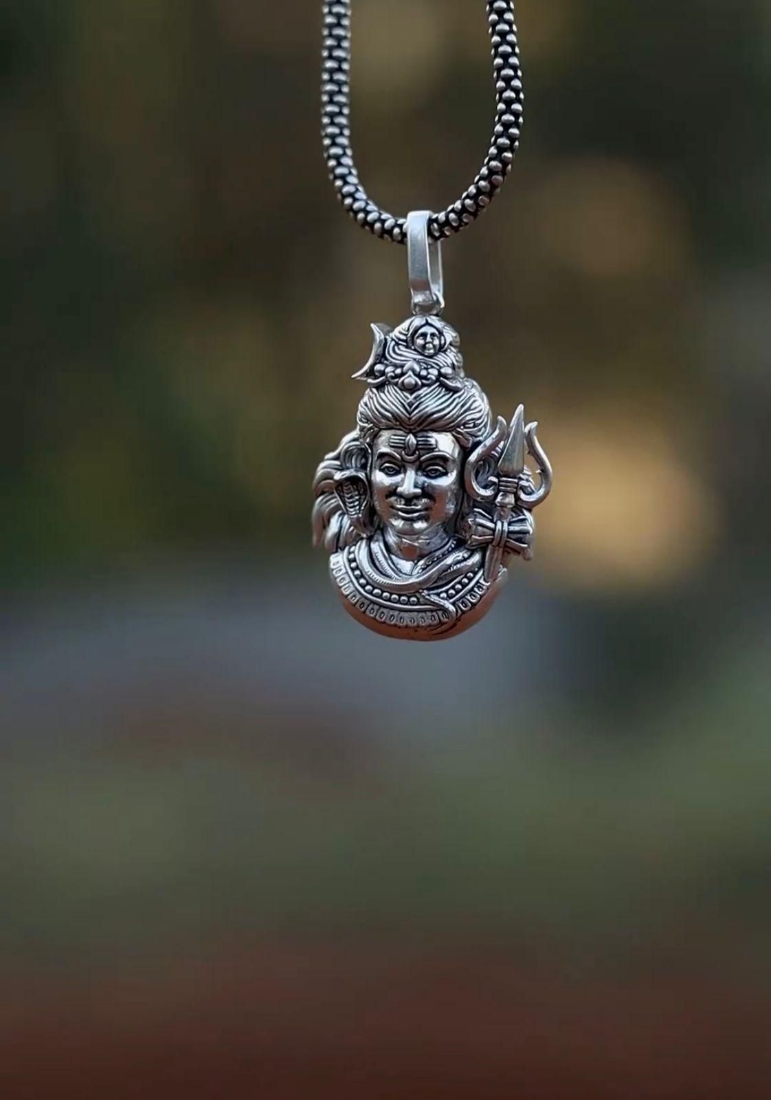 Silver Mahadev pendant necklace featuring intricate Lord Shiva design on a stylish chain