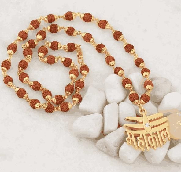 Rudraksha Mala with Mahakal pendant featuring golden accents and intricate design, perfect for spiritual use