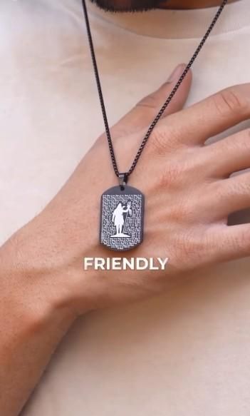 108 Om Namah Shivay pendant on a chain displayed on a person's hand for spiritual wear