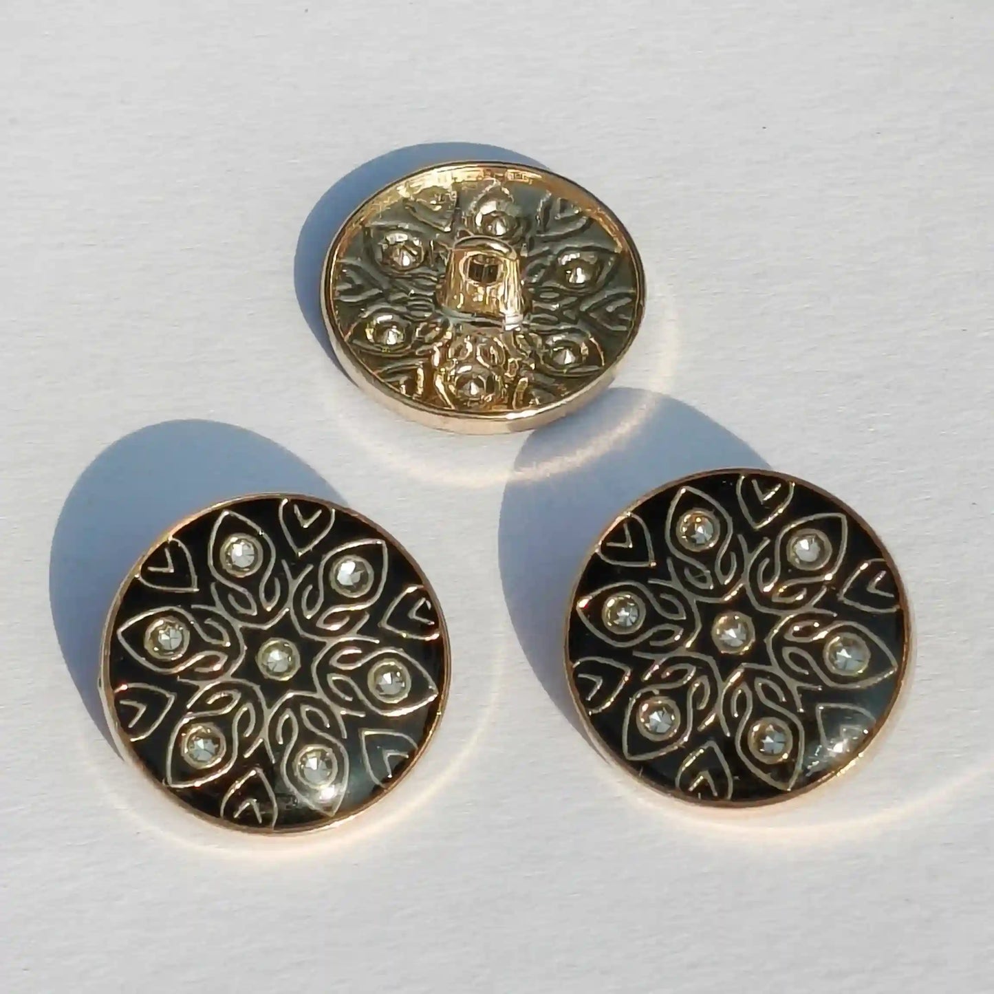 Black enamel gold metal buttons close-up crystal detail India – Gleemify