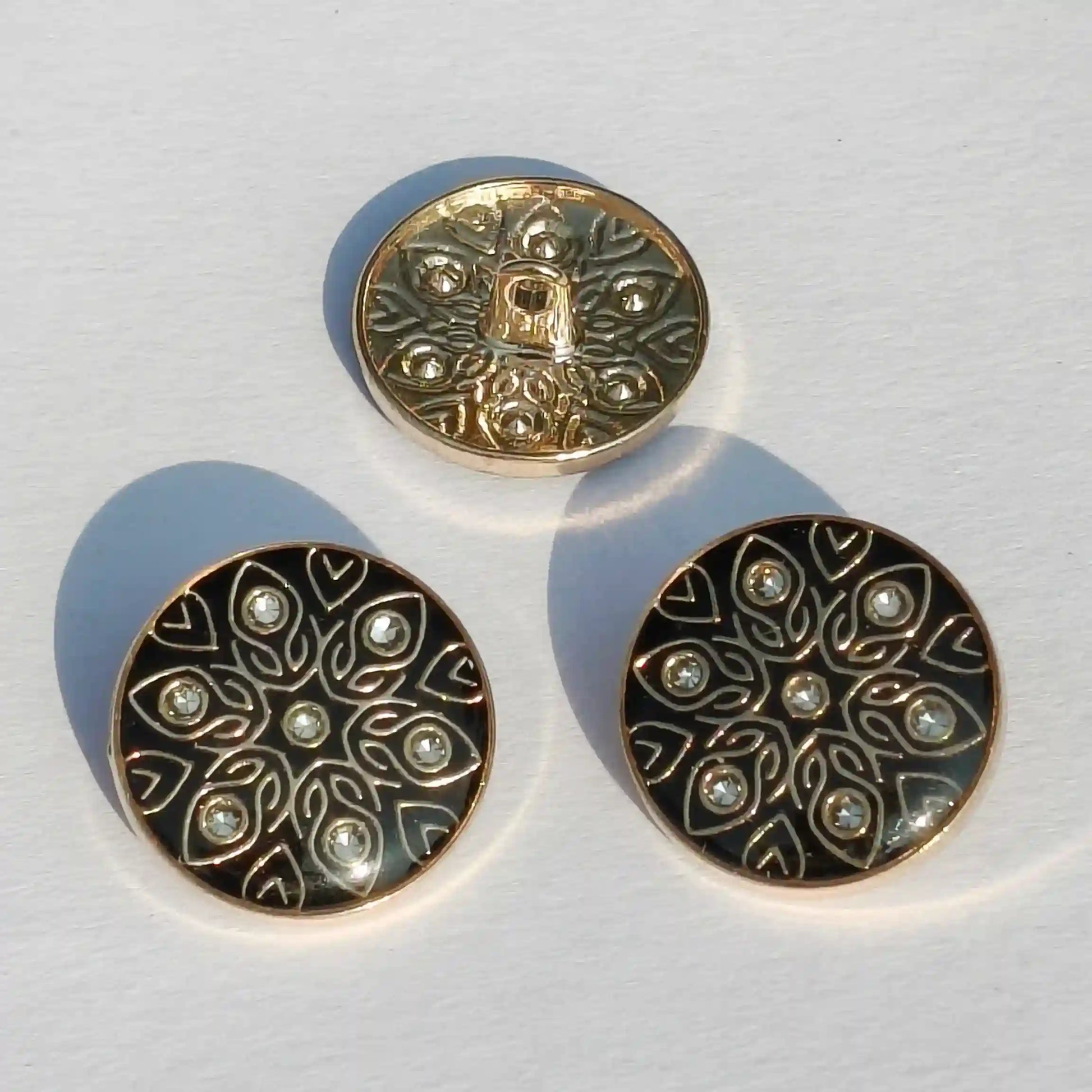 Black enamel gold metal buttons close-up crystal detail India – Gleemify