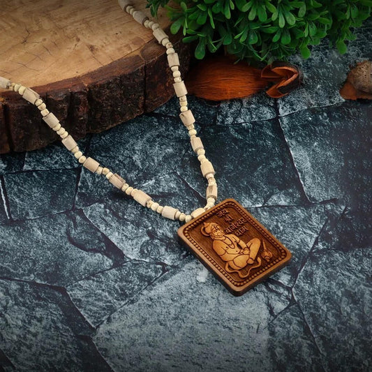Bageshwar Dham Tulsi Mala with Wooden Hanumanji Locket on a rustic stone surface