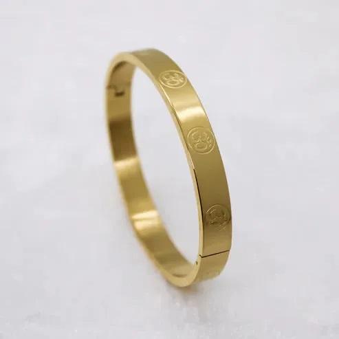 Carved Om Gold Plated Bracelet featuring elegant design and spiritual symbolism for fashion lovers