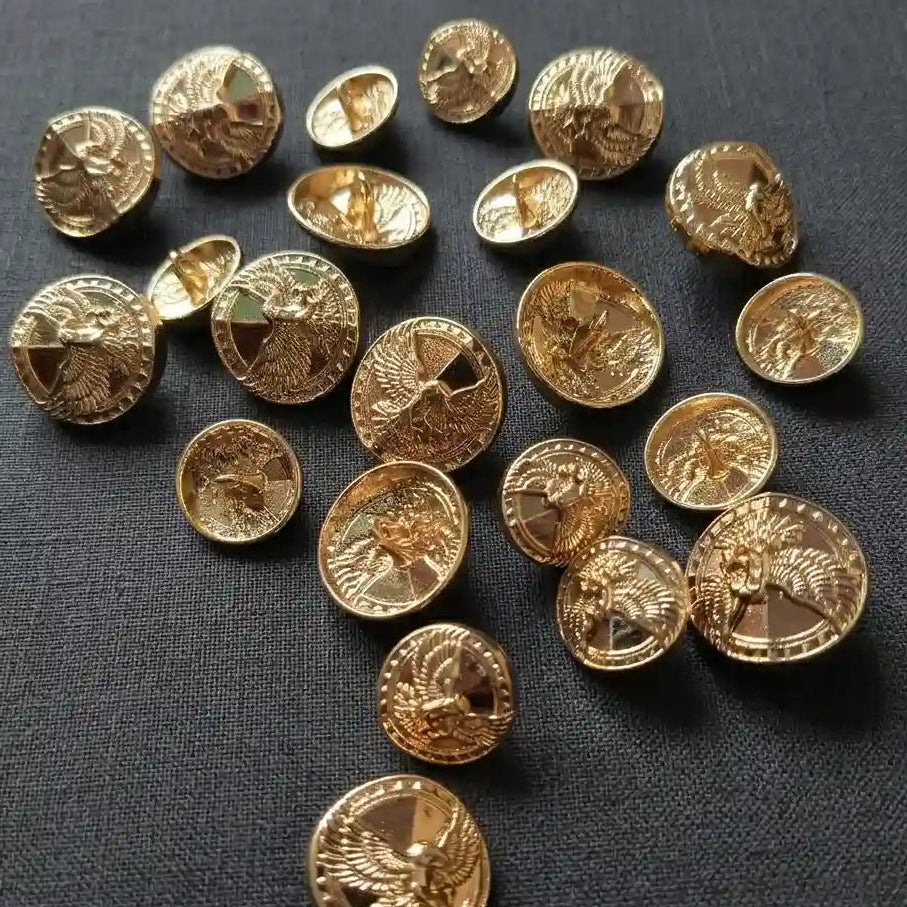 A complete 12pc set of Gleemify antique gold eagle shank buttons for suit jackets and sport coats, displaying a premium heritage motif on a dark grey background.