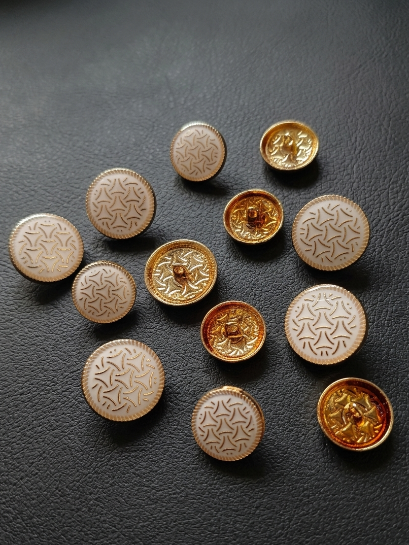 A 12pc set of Gleemify decorative buttons for sport coats and jackets, including large and small vintage-style gold buttons on a dark grey background.