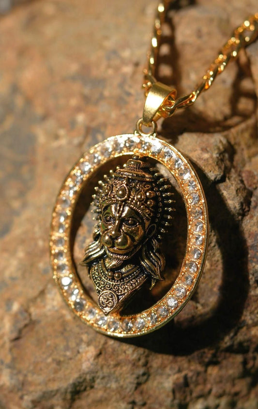 Gold Hanuman ji pendant with intricate detailing and sparkling stone accents in an elegant design