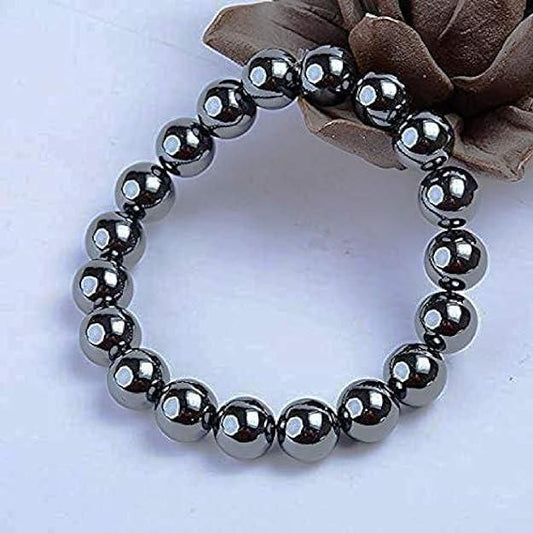 Natural Round Beads Magnetic Hematite Crystal Stone 8mm Bracelet in a stylish display with a rose background